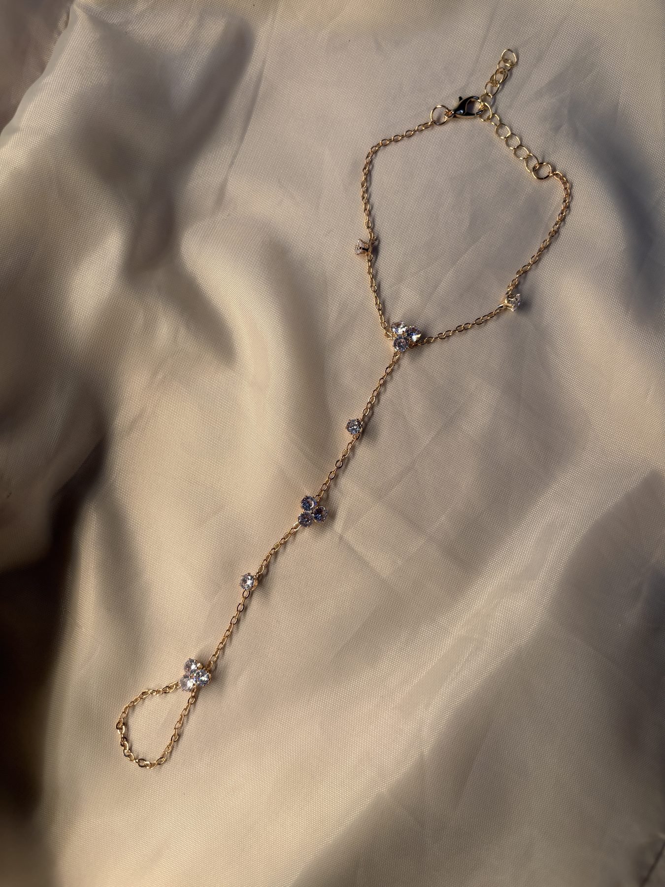 The Blossom Hand Chain laid flat